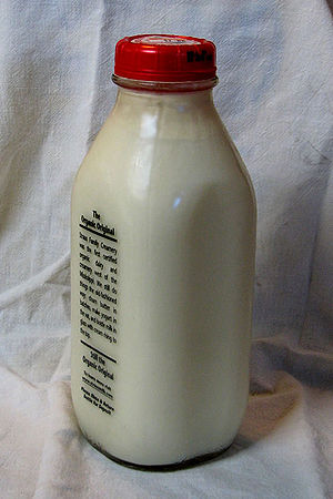 English: milk bottle showing cream at the top